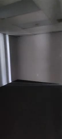 a view of an empty room and wooden floor