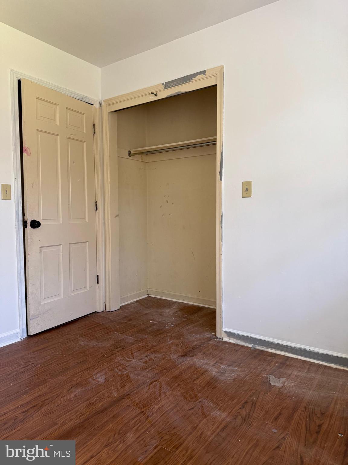 31939 Downing Road Delmar, MD 21875 - Photo 28 of 34 an empty room with wooden floor and closet area