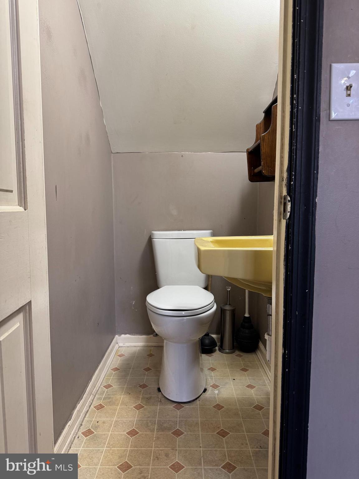 31939 Downing Road Delmar, MD 21875 - Photo 10 of 34 a bathroom with a toilet and a sink