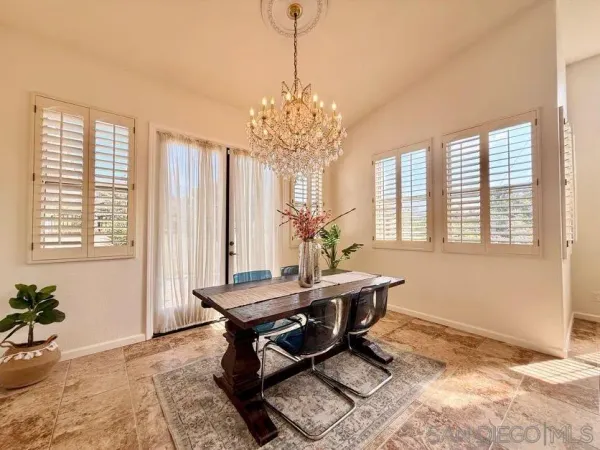 a workspace with furniture and a chandelier
