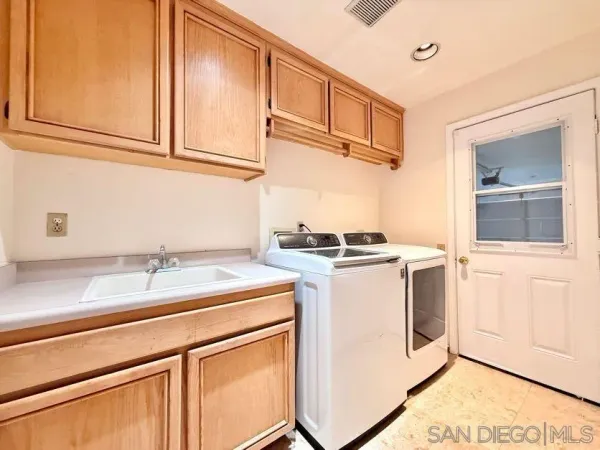 a view of balcony with two chairs and a table