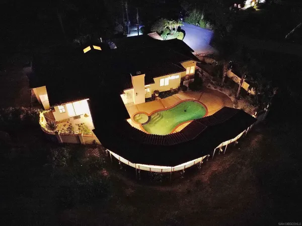 a view of swimming pool with outdoor seating