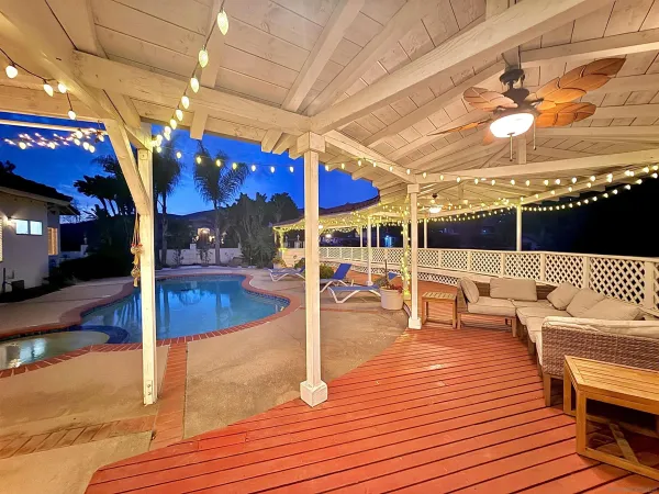 a view of a patio with a table and chairs