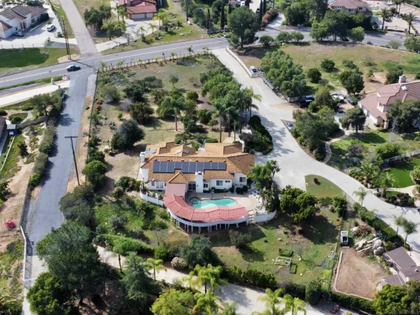 an aerial view of a house with outdoor space