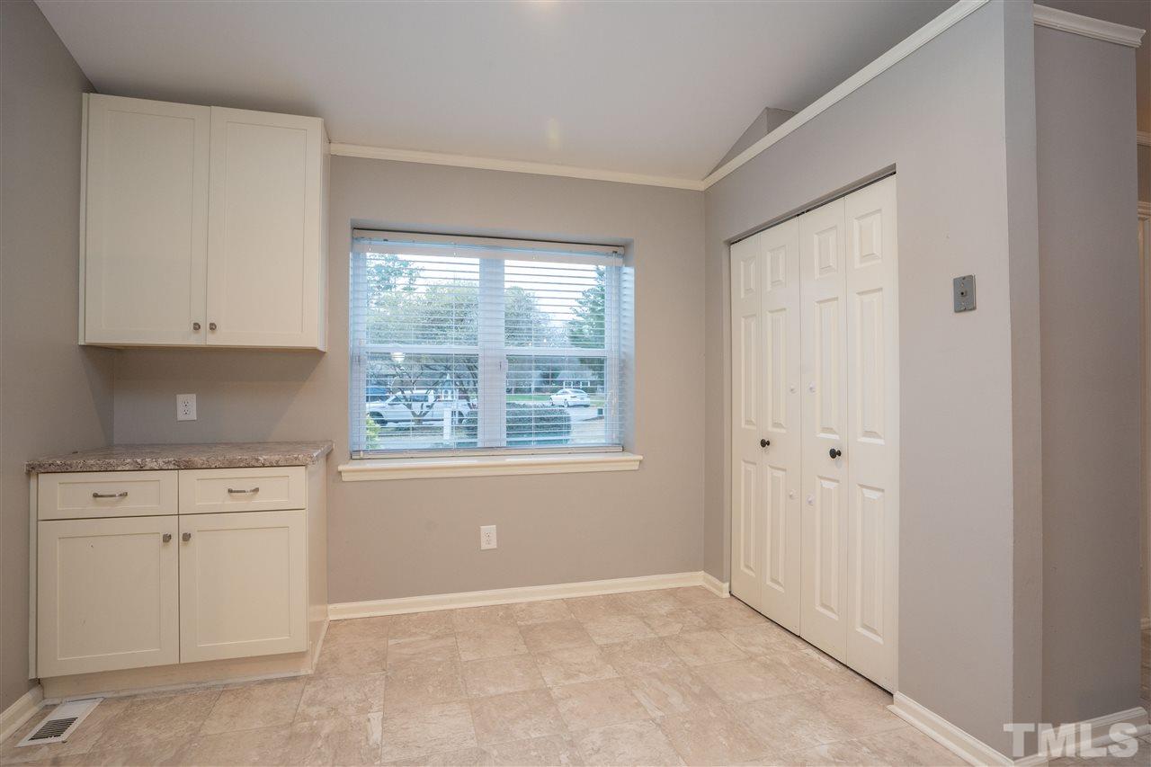 5400 Chilham Place Raleigh, NC 27612 - Photo 8 of 25 a view of cabinets and window