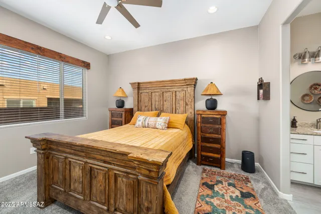 a bedroom with a bed and a dresser