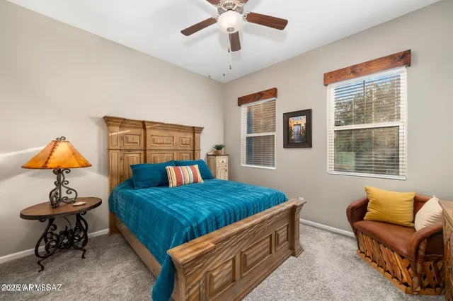 a bedroom with a bed and a dresser in it