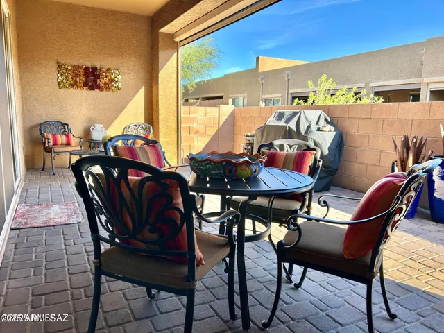 a view of a dining room with furniture and window