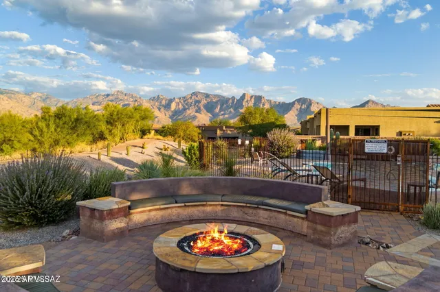 a view of a chairs and table in the patio