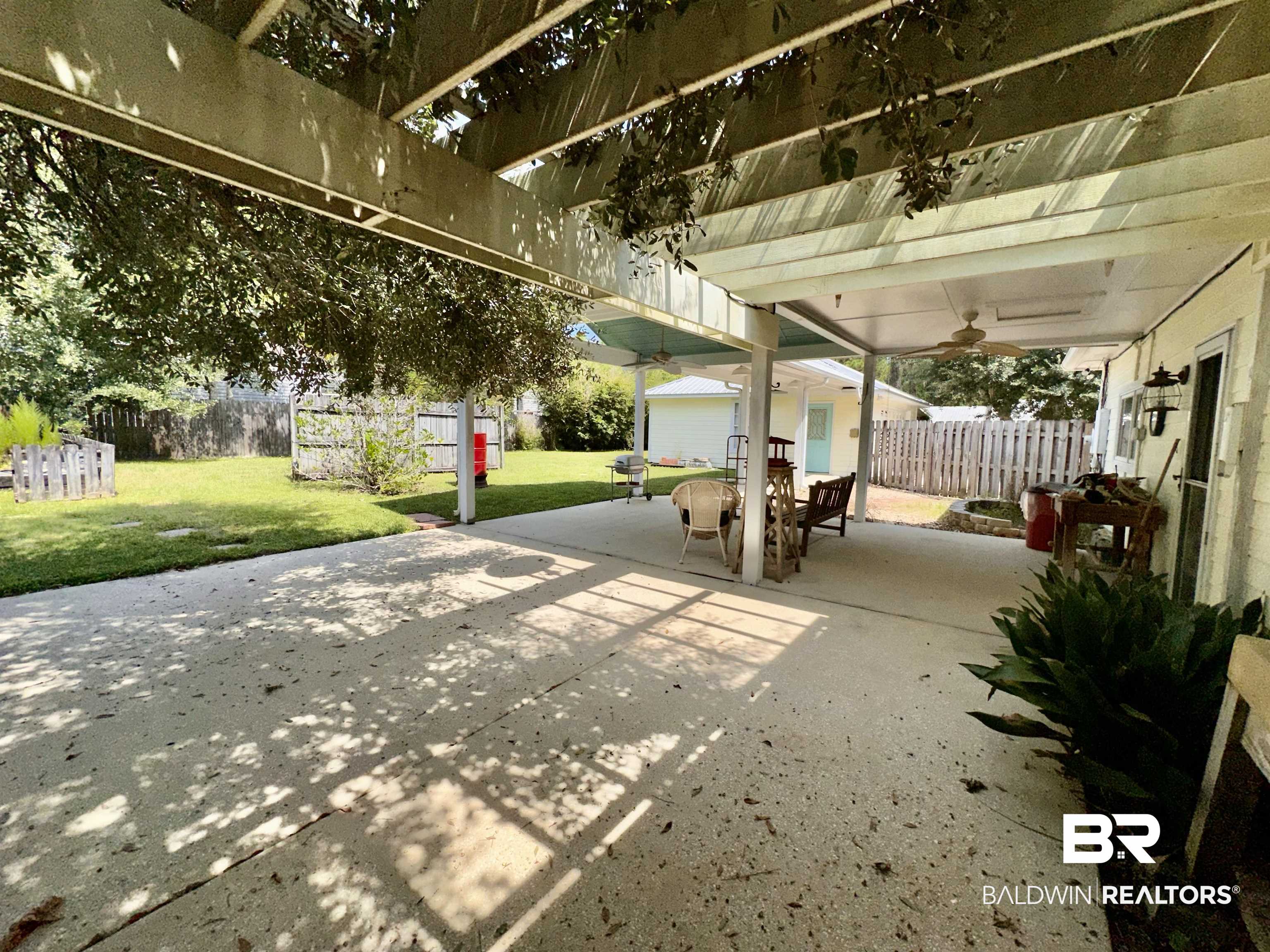 9101 Coronada Road Elberta, AL 36530 - Photo 21 of 27 View of patio / terrace with an outbuilding and outdoor dining area
