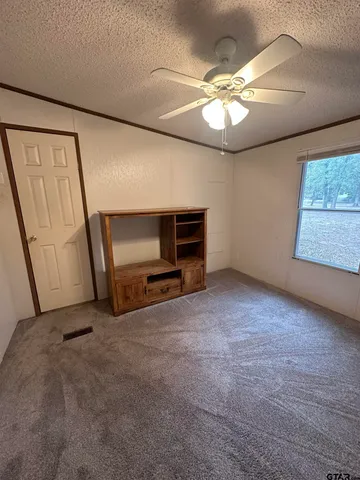 an empty room with yard & wooden floor