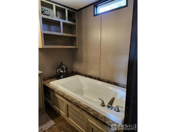 a bathroom with a tub and a sink