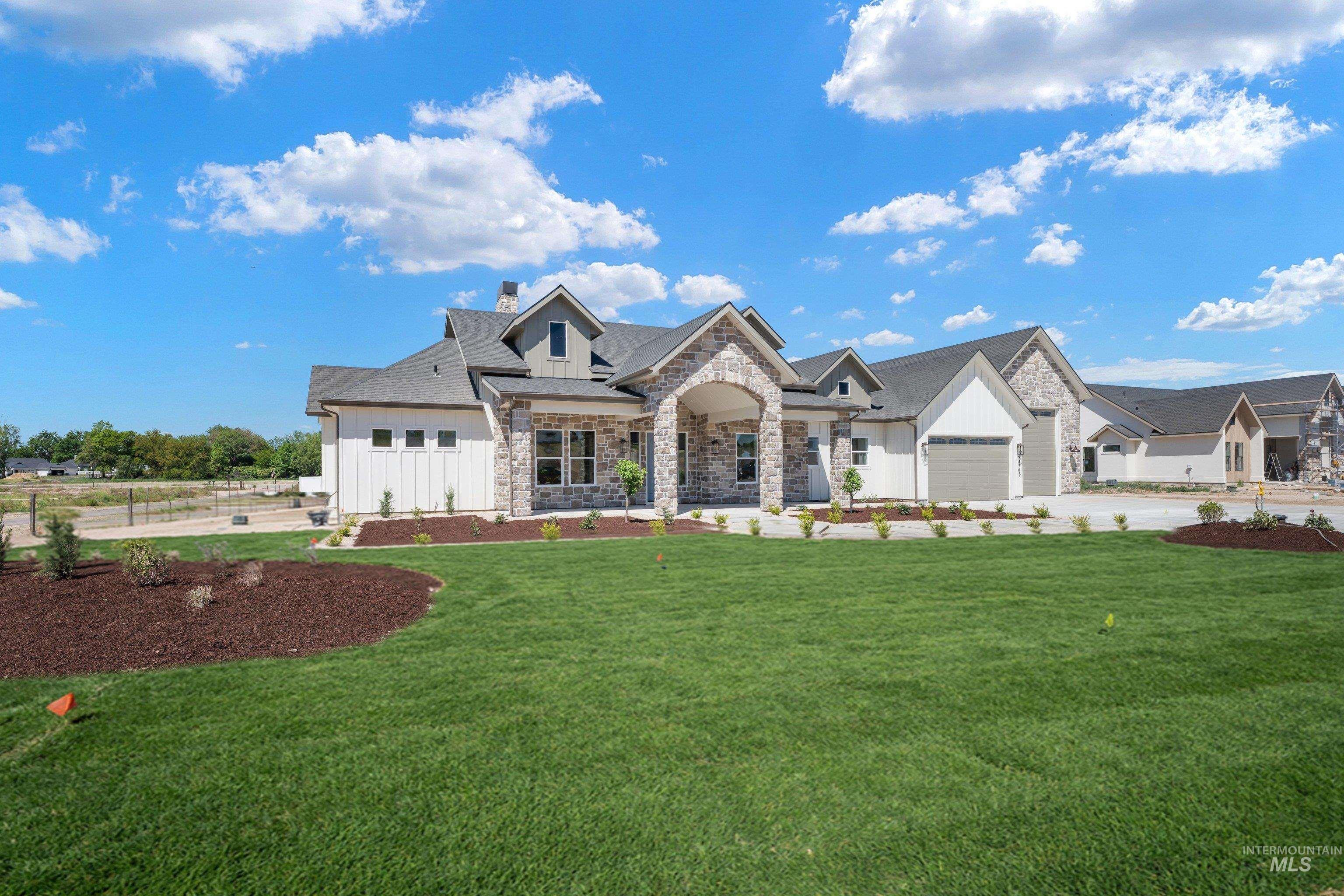 24821 Ardmore Court Caldwell, ID 83607 - Photo 2 of 43 Contemporary single-story residence featuring a stone and board-and-batten exterior