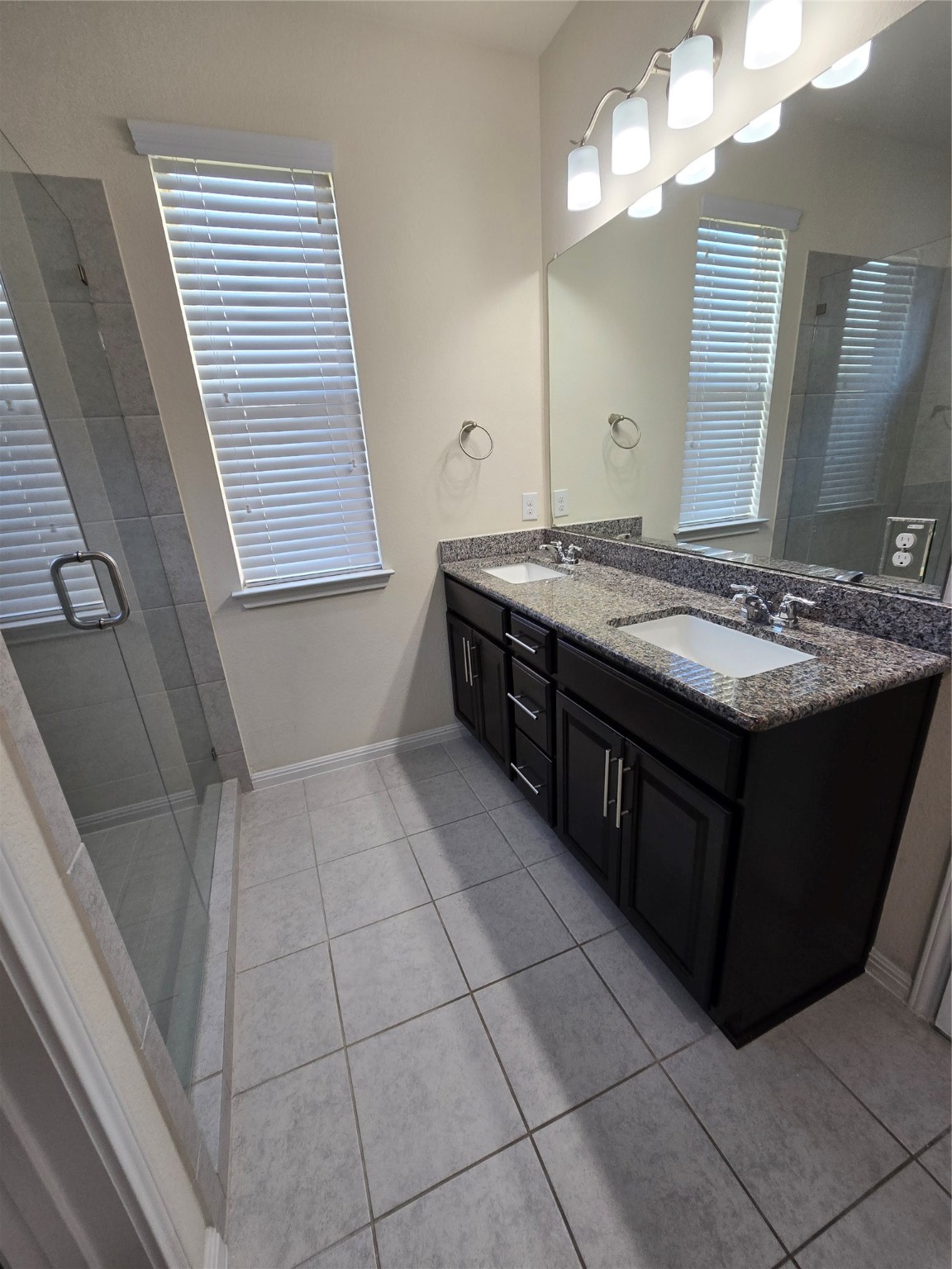 3240 East Whitestone Boulevard, Unit 49 Cedar Park, TX 78613 - Photo 13 of 33 a bathroom with a sink a vanity and a mirror