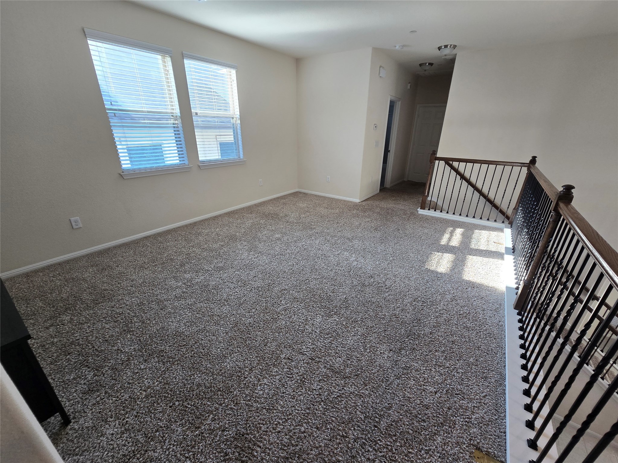 3240 East Whitestone Boulevard, Unit 49 Cedar Park, TX 78613 - Photo 20 of 33 an empty room with windows