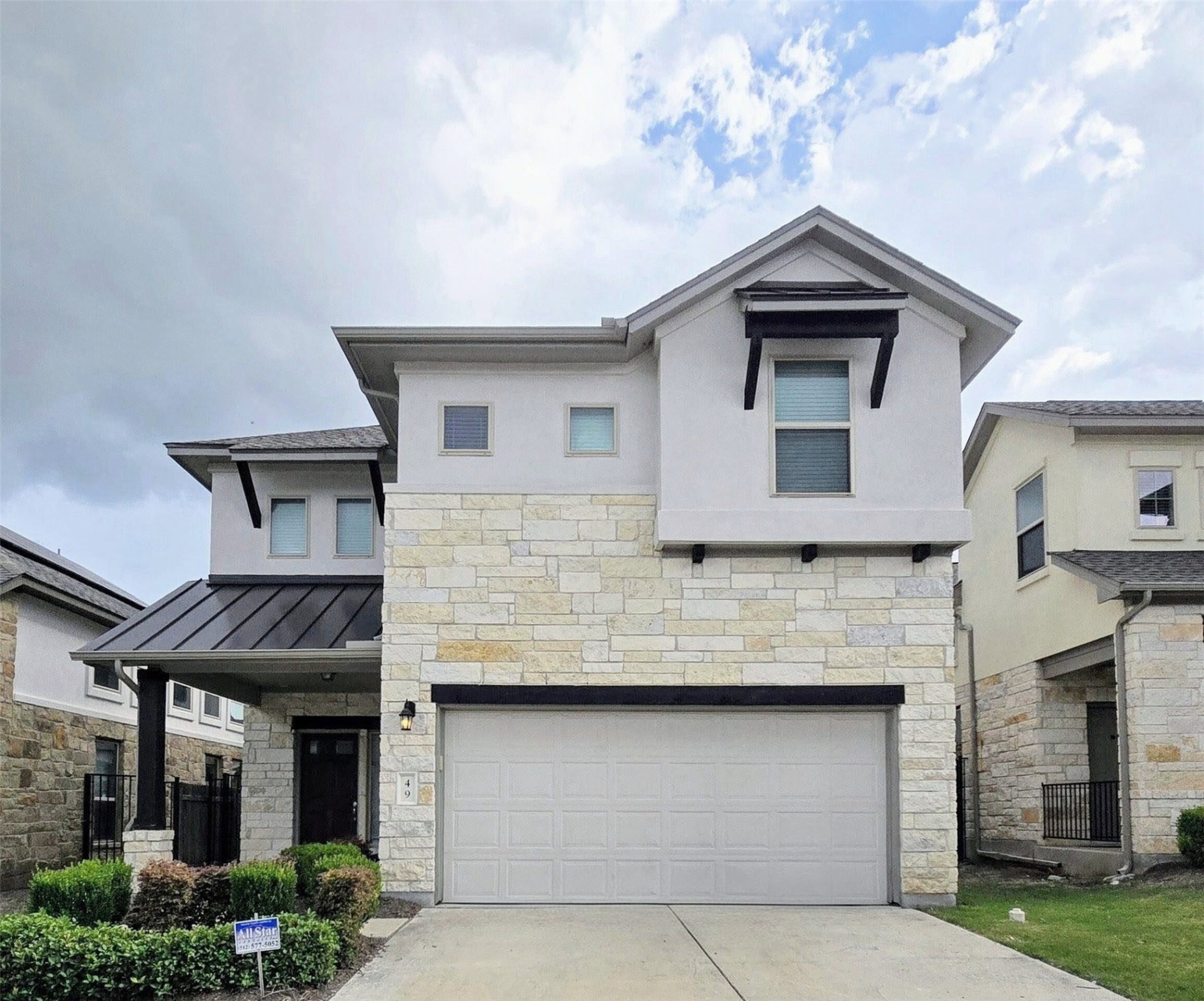 3240 East Whitestone Boulevard, Unit 49 Cedar Park, TX 78613 - Photo 2 of 33 a front view of a house with garage