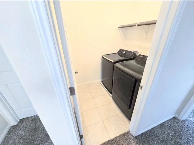 a view of a hallway with stairs