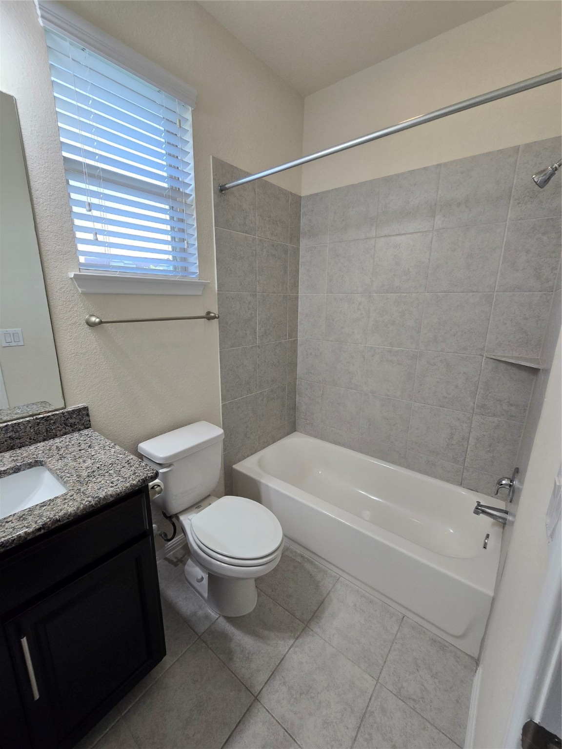 3240 East Whitestone Boulevard, Unit 49 Cedar Park, TX 78613 - Photo 26 of 33 a bathroom with a granite countertop sink toilet and shower