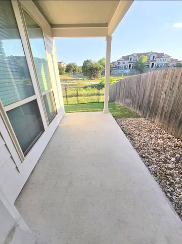 a view of swimming pool with a yard and seating space