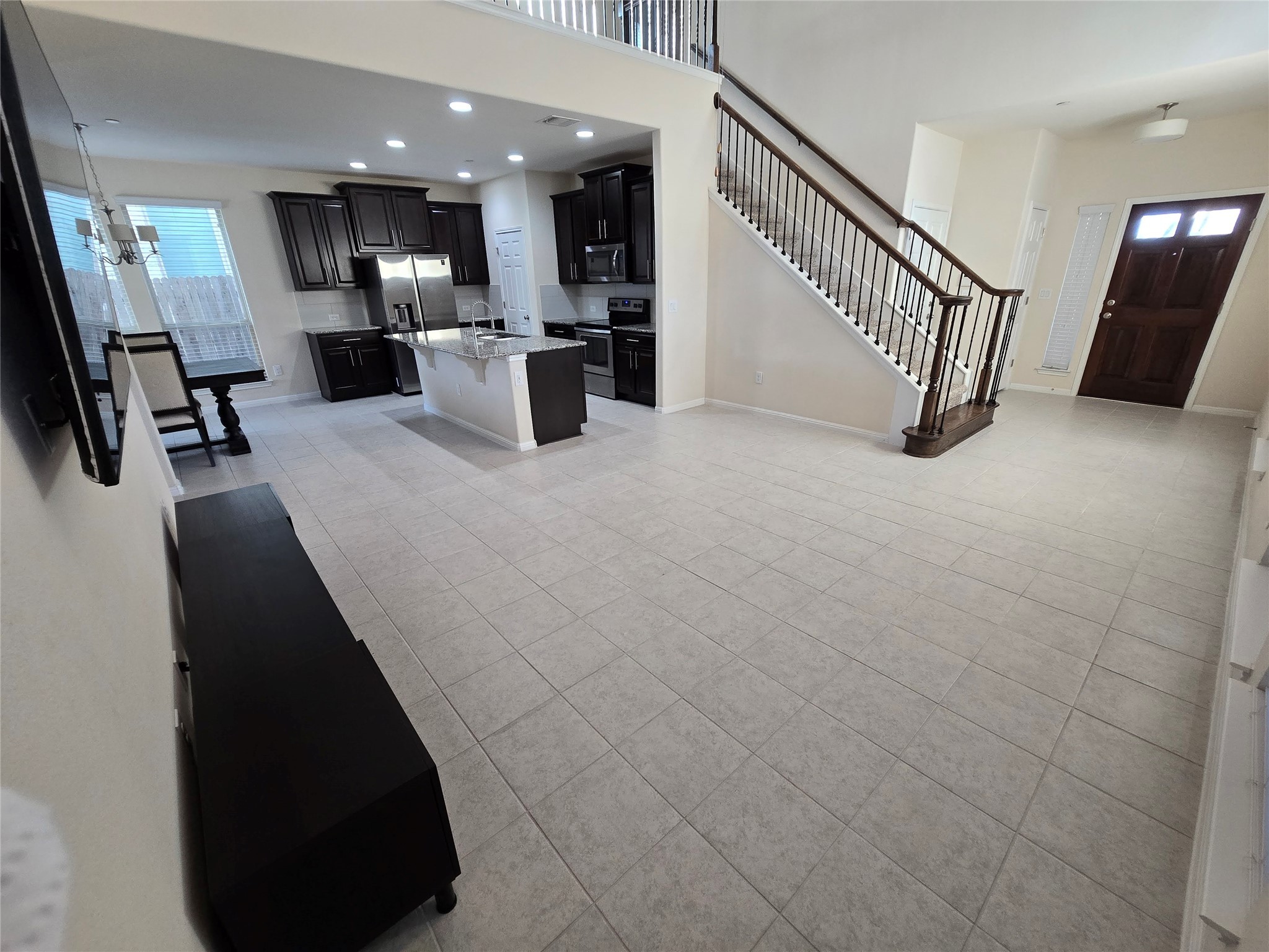3240 East Whitestone Boulevard, Unit 49 Cedar Park, TX 78613 - Photo 5 of 33 a living room with furniture and a flat screen tv