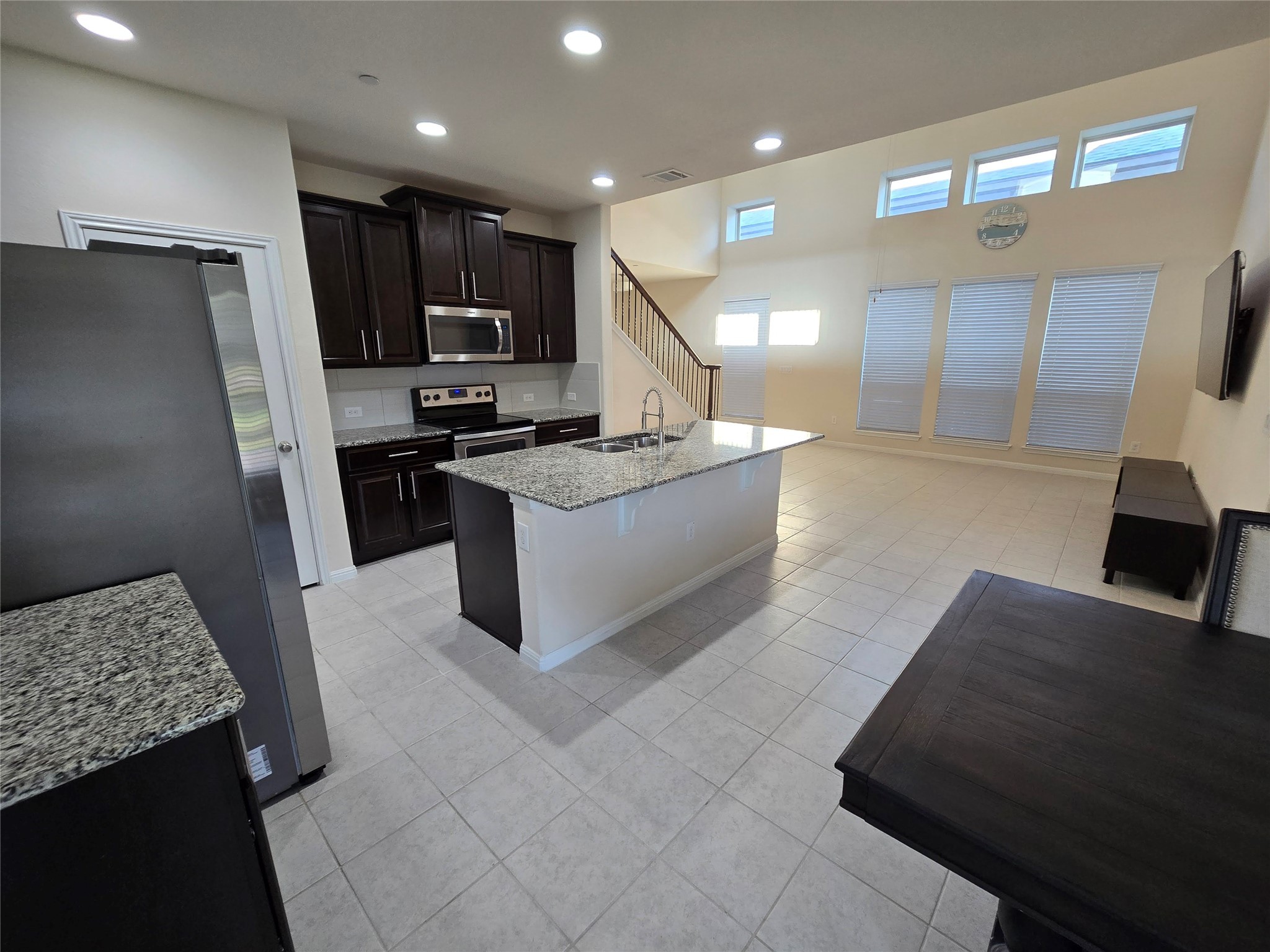 3240 East Whitestone Boulevard, Unit 49 Cedar Park, TX 78613 - Photo 9 of 33 a kitchen with stainless steel appliances granite countertop a refrigerator and a stove