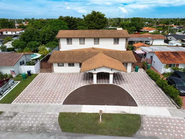 an aerial view of a house with a garden view