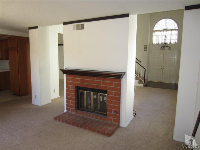 858 Congressional Road Simi Valley, CA 93065 - Photo 14 of 30 a living room with furniture and a fireplace