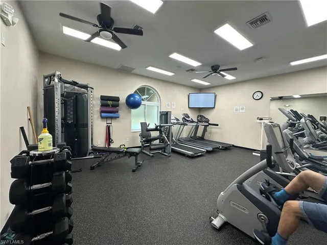 a view of a patio with a table chairs and backyard