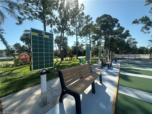 a view of a patio with chairs and a table