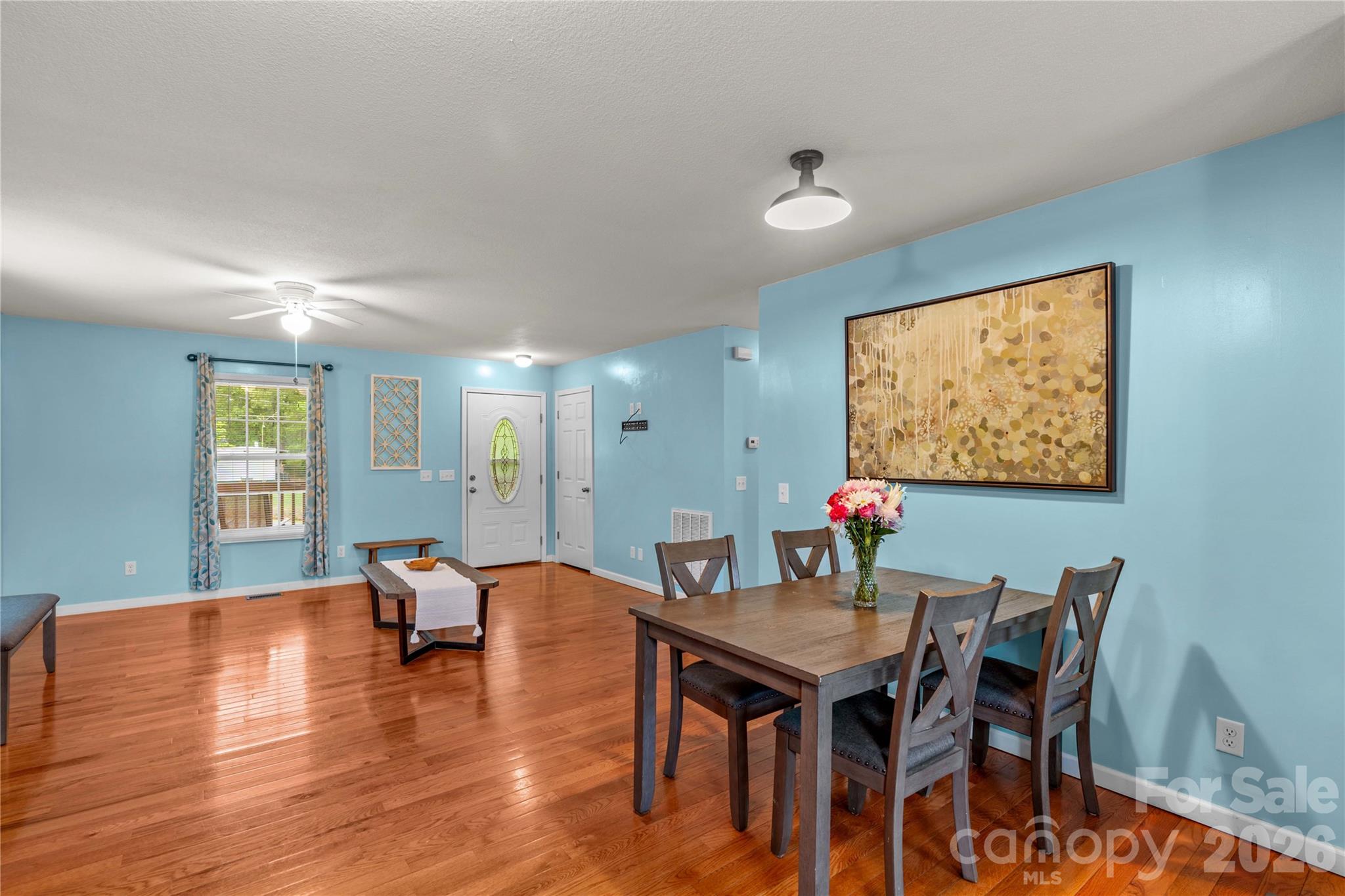 1026 Blue Ridge Ventures Morganton, NC 28655 - Photo 12 of 28 a view of a dining room with furniture window and wooden floor