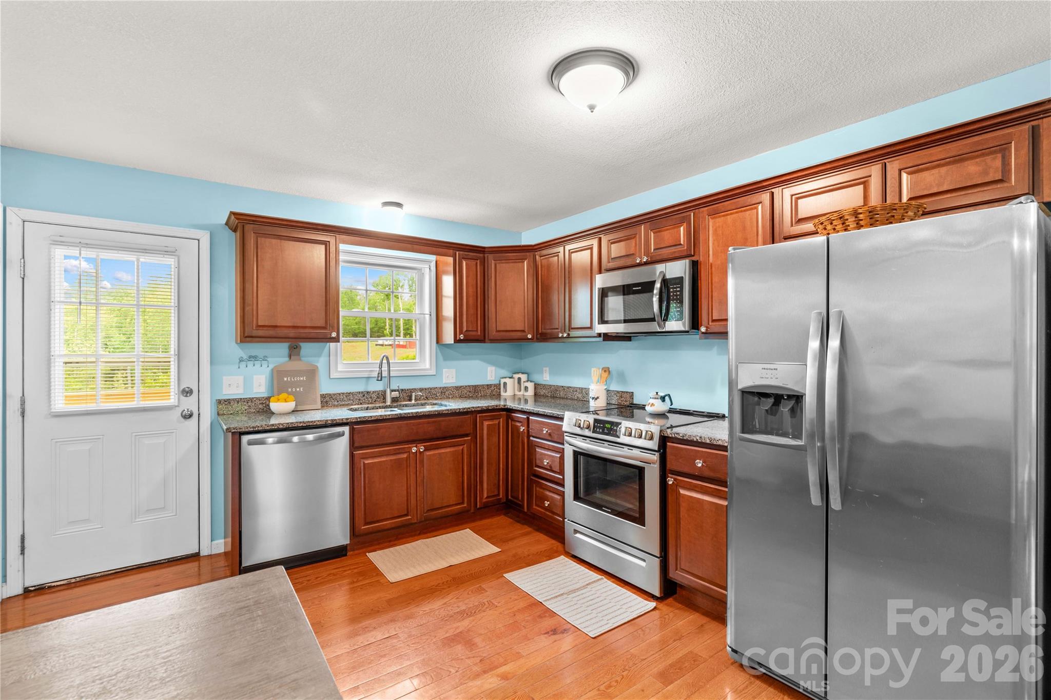 1026 Blue Ridge Ventures Morganton, NC 28655 - Photo 13 of 28 a kitchen with stainless steel appliances granite countertop a refrigerator stove top oven and sink
