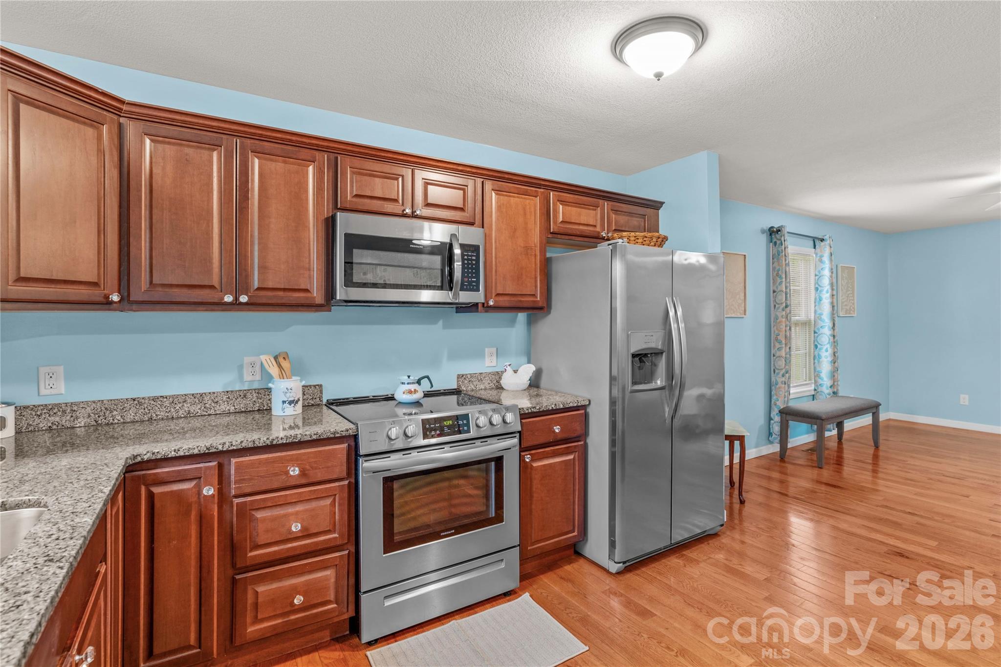 1026 Blue Ridge Ventures Morganton, NC 28655 - Photo 15 of 28 a kitchen with stainless steel appliances granite countertop a refrigerator stove and sink