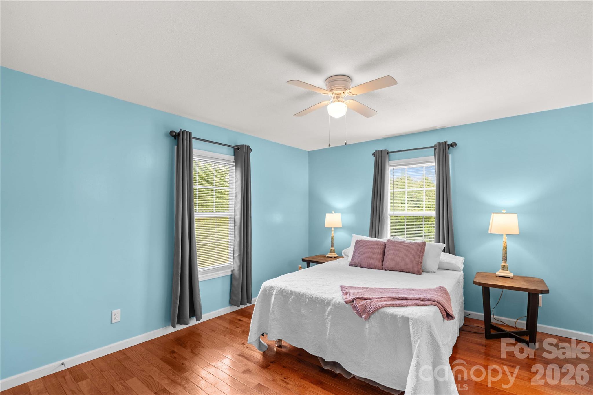 1026 Blue Ridge Ventures Morganton, NC 28655 - Photo 16 of 28 a bedroom with a bed and a chandelier