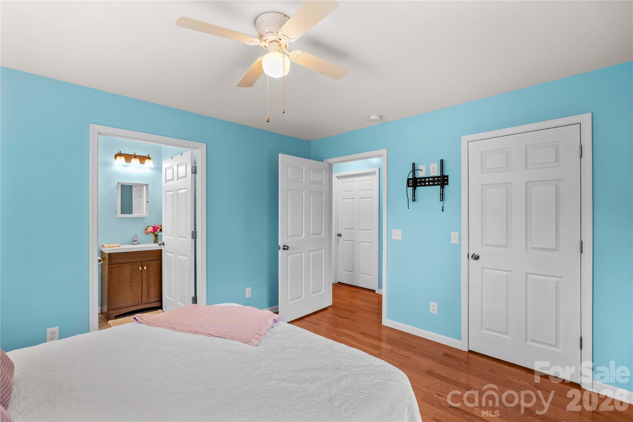 1026 Blue Ridge Ventures Morganton, NC 28655 - Photo 17 of 28 a bedroom with a bed and a chandelier