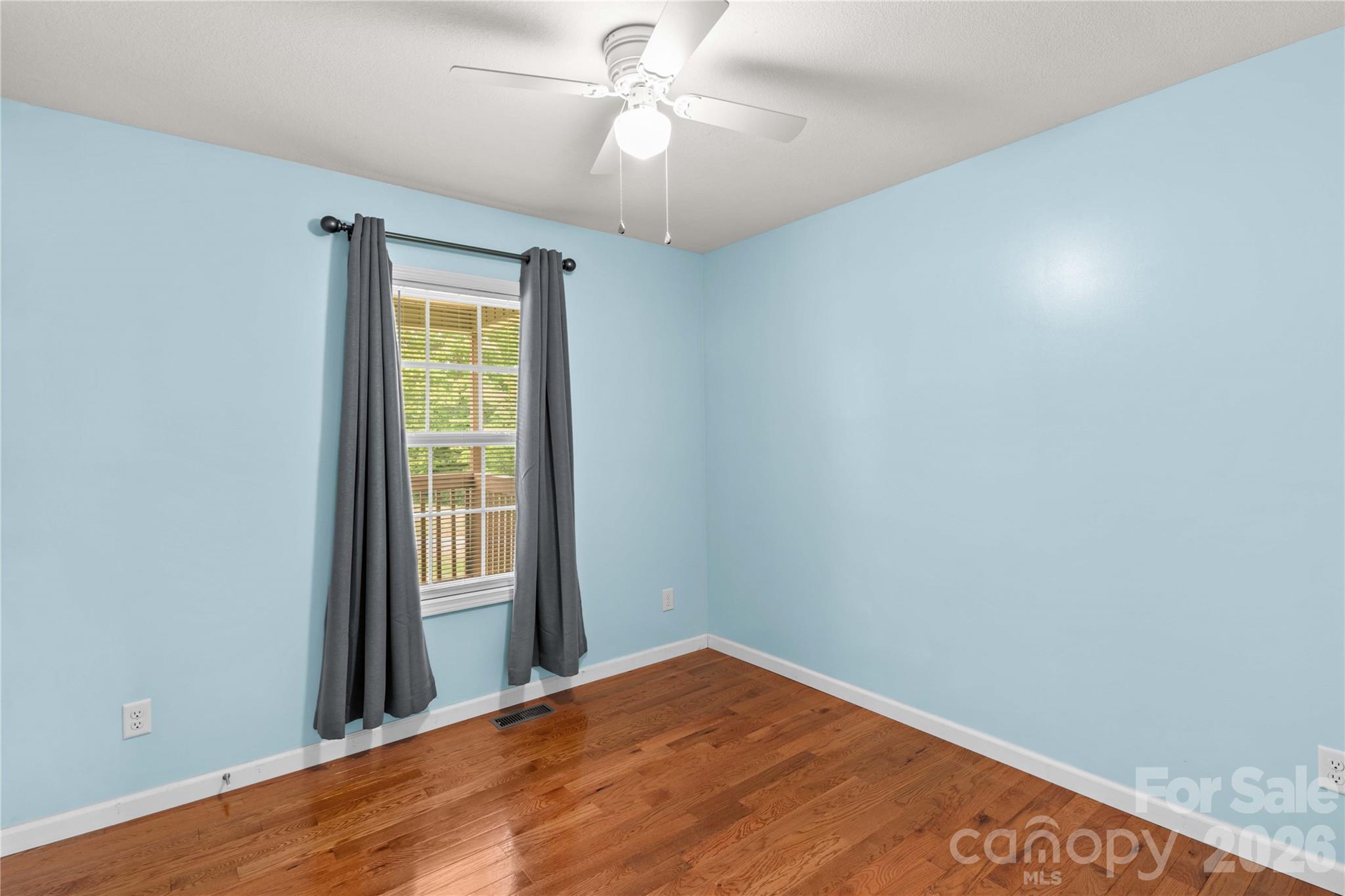 1026 Blue Ridge Ventures Morganton, NC 28655 - Photo 19 of 28 a view of empty room with window and ceiling fan