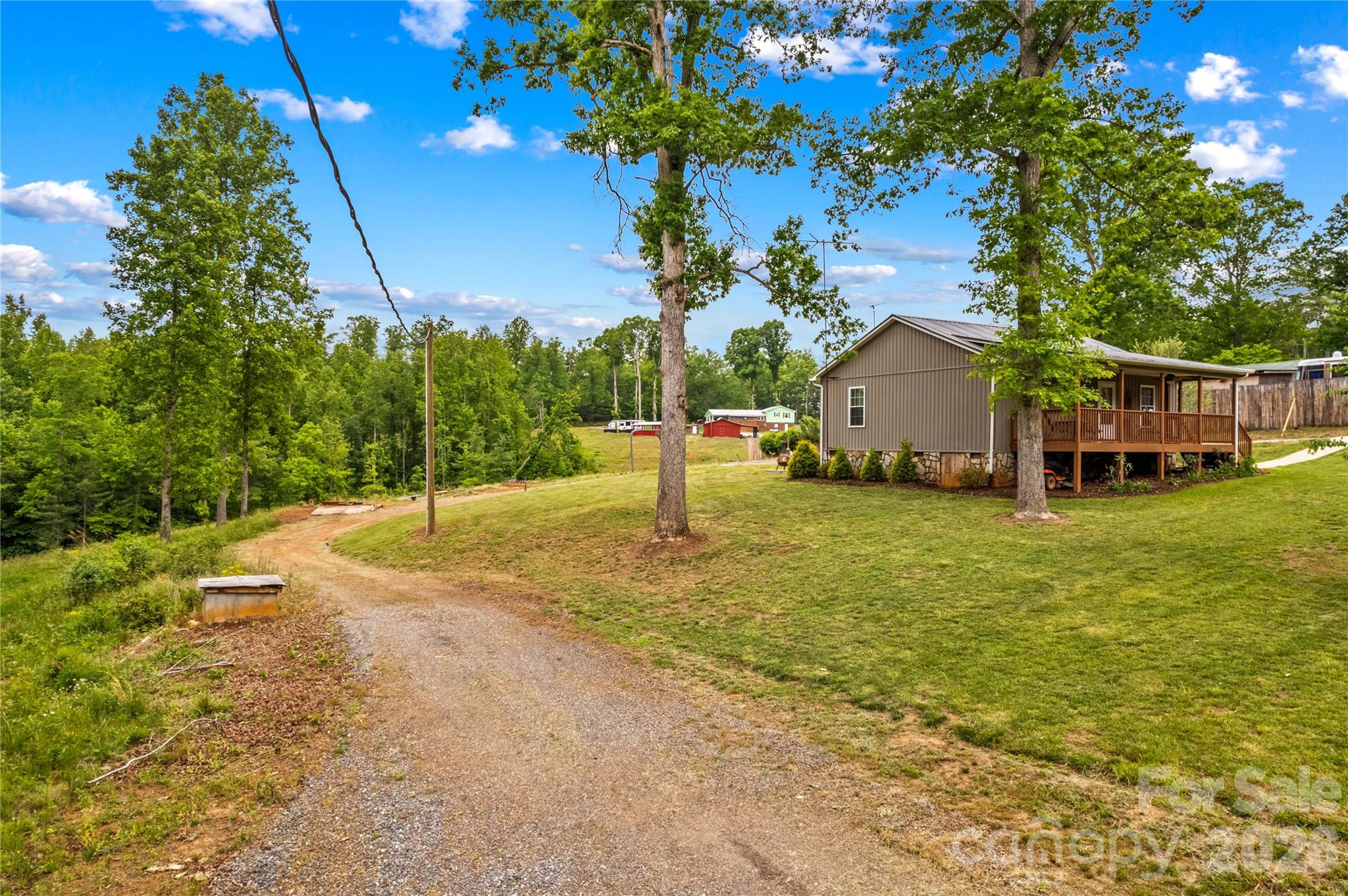 1026 Blue Ridge Ventures Morganton, NC 28655 - Photo 26 of 28 a view of a house with backyard and tree s