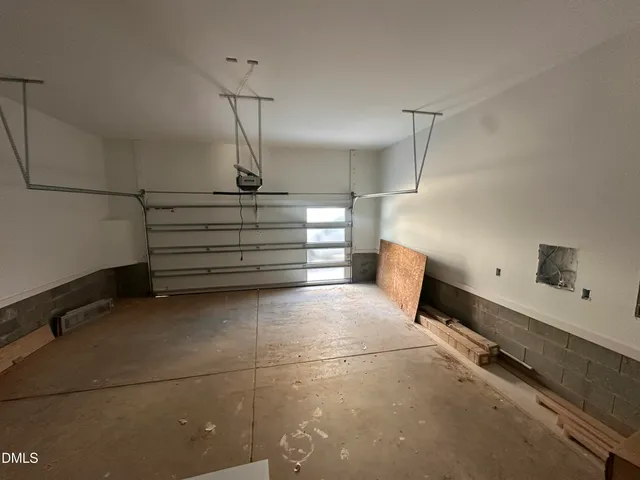 a storage & utility room with racks on the wall
