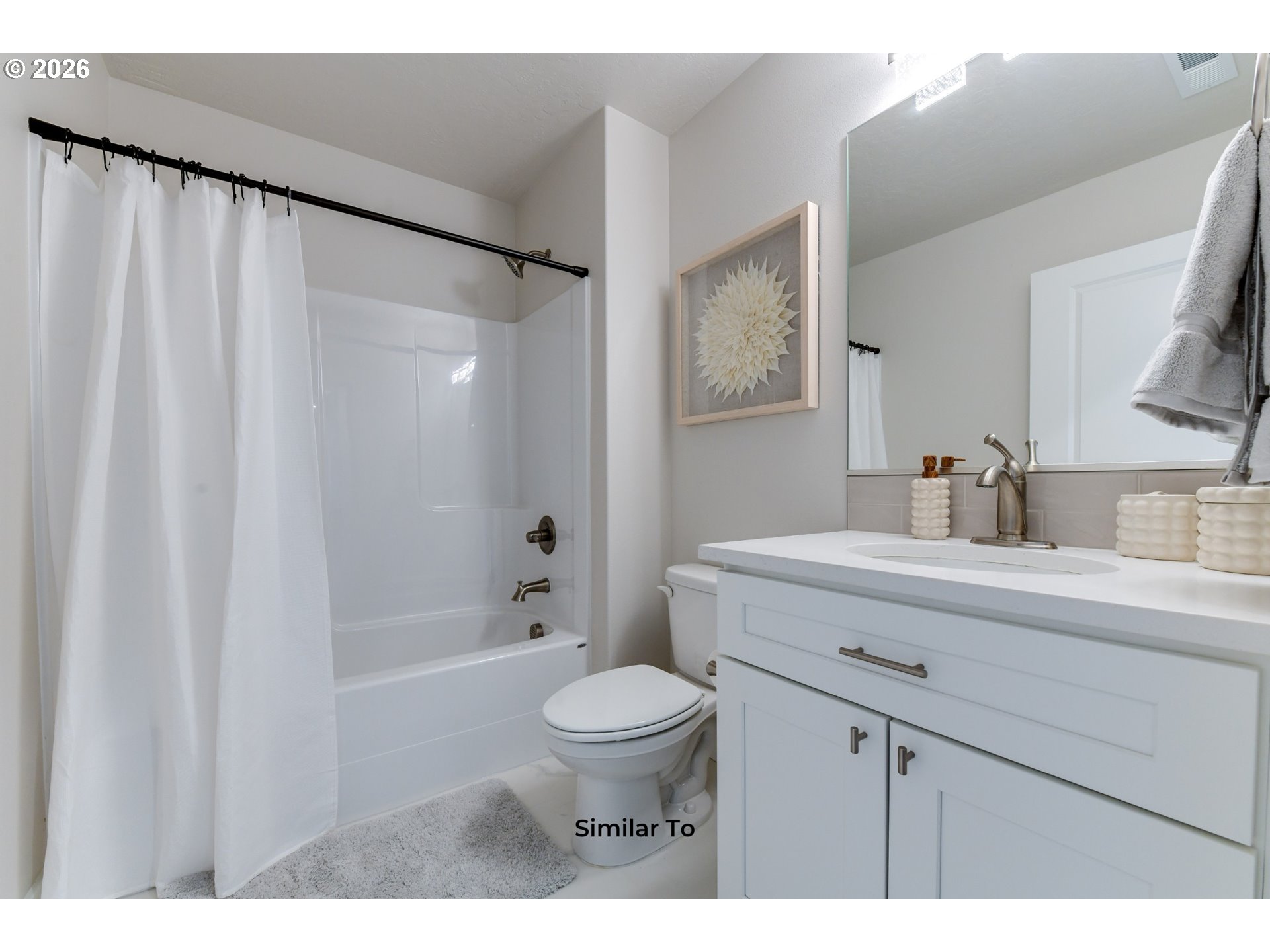 227 Southwest Goldfinch Lane Boardman, OR 97818 - Photo 13 of 28 a bathroom with a sink a toilet and a mirror