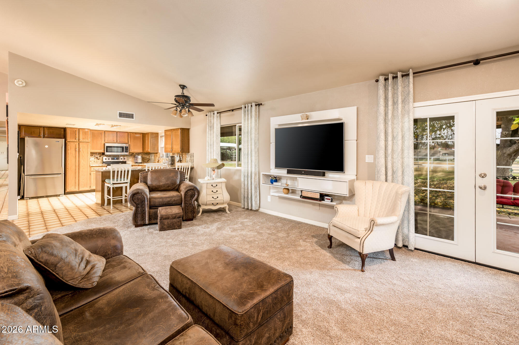 4730 West Piedmont Road Laveen, AZ 85339 - Photo 14 of 65 a living room with furniture and a flat screen tv