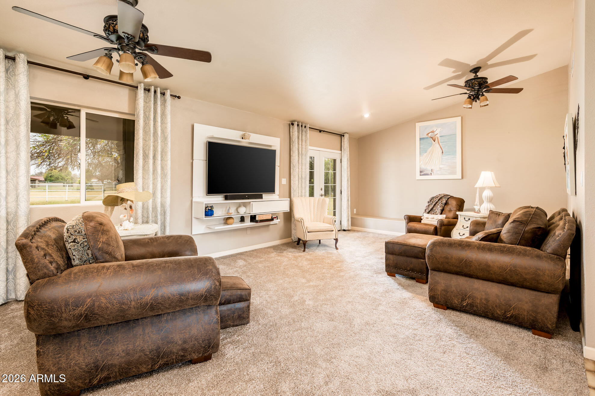 4730 West Piedmont Road Laveen, AZ 85339 - Photo 15 of 65 a living room with furniture and a flat screen tv