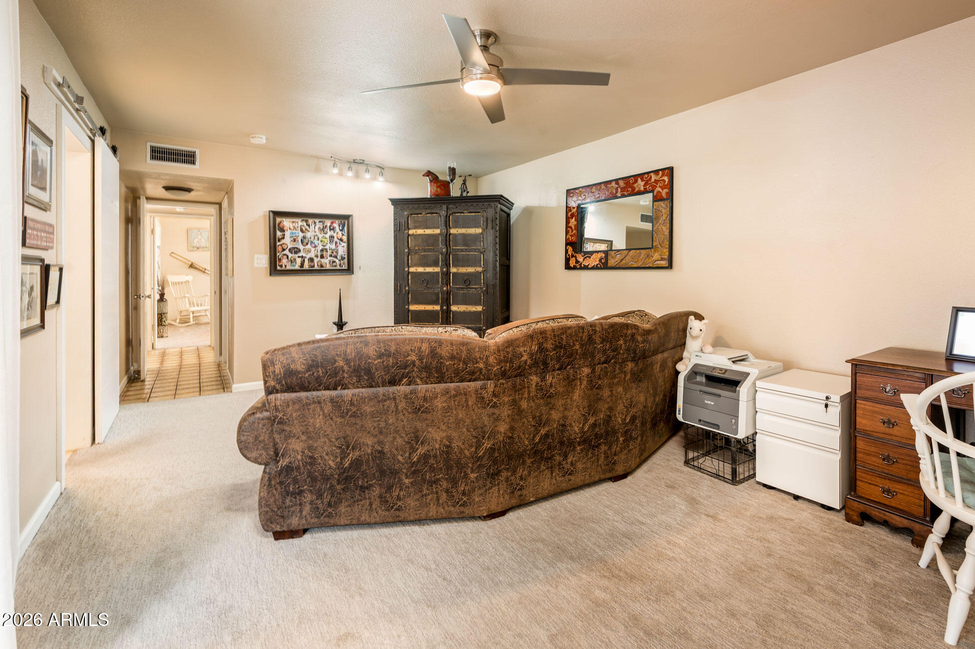 4730 West Piedmont Road Laveen, AZ 85339 - Photo 19 of 65 a living room with furniture a ceiling fan and a window