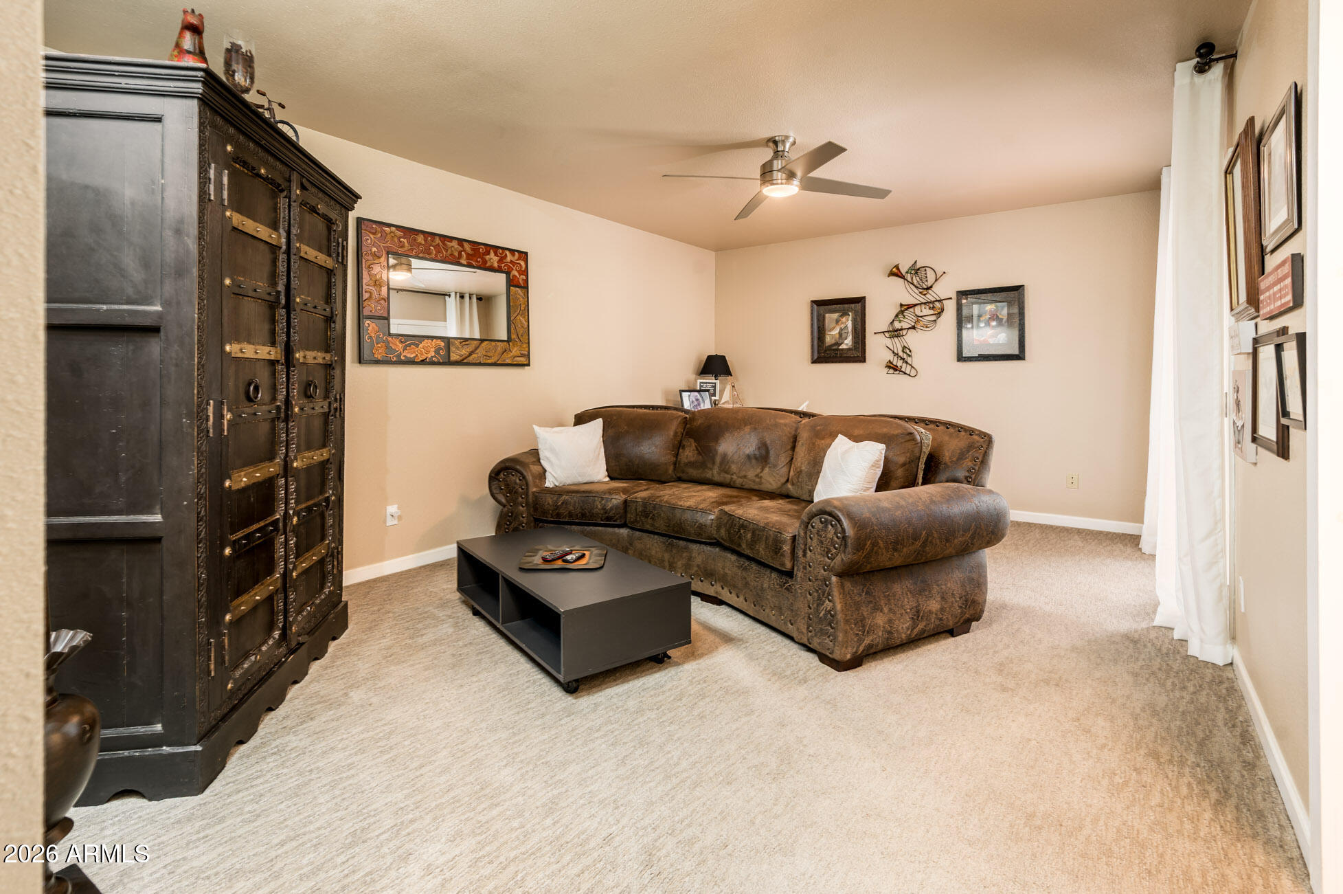 4730 West Piedmont Road Laveen, AZ 85339 - Photo 20 of 65 a living room with furniture and a flat screen tv