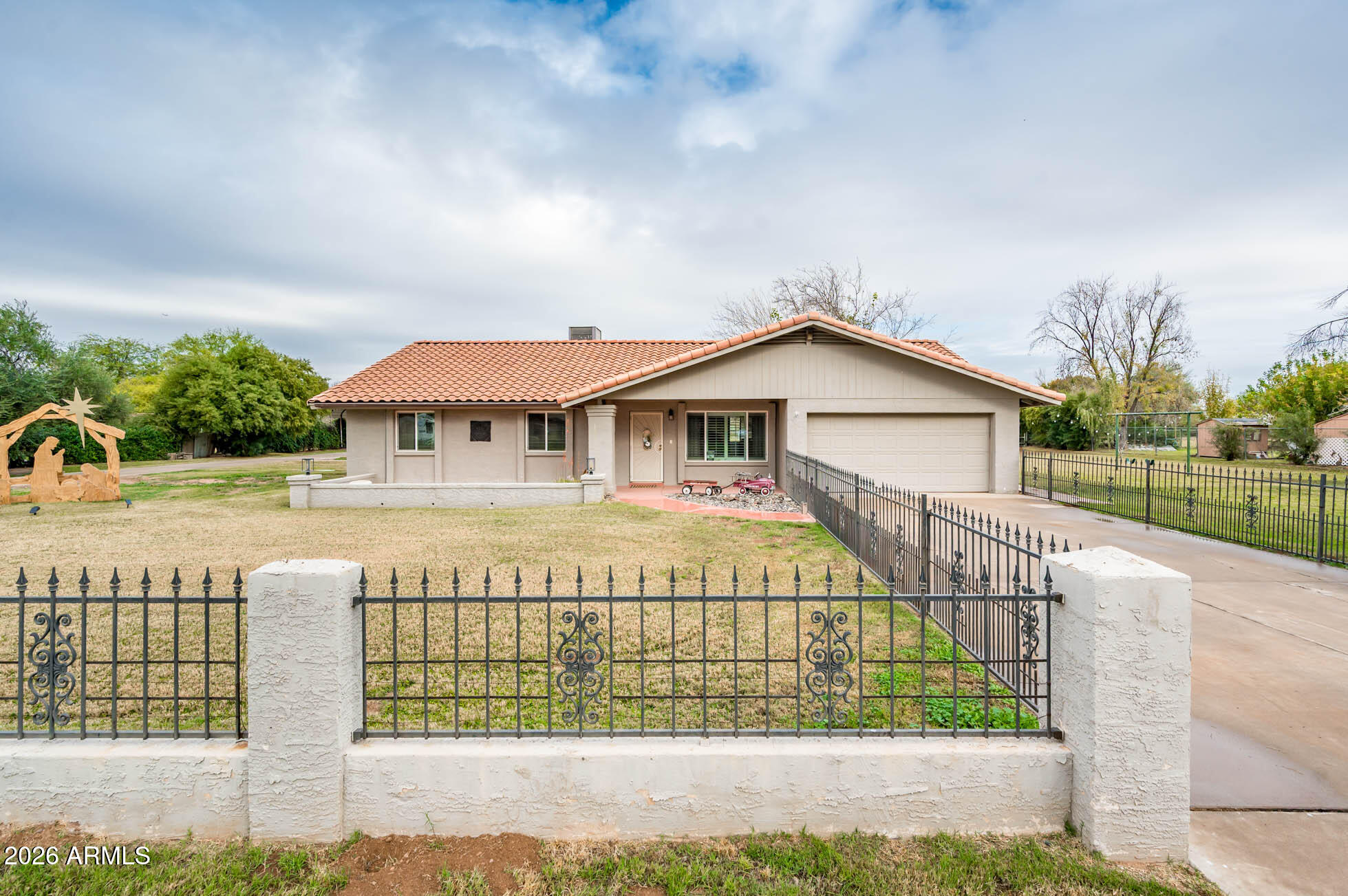 4730 West Piedmont Road Laveen, AZ 85339 - Photo 2 of 65 a front view of a house with a yard
