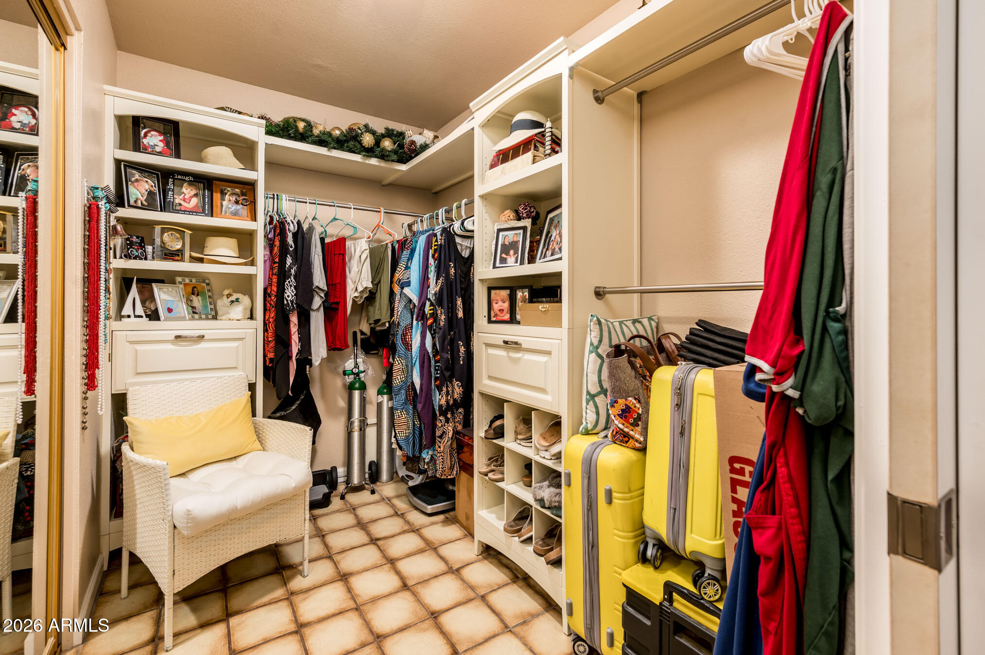 4730 West Piedmont Road Laveen, AZ 85339 - Photo 22 of 65 a view of walk in closet with clothes and shoes
