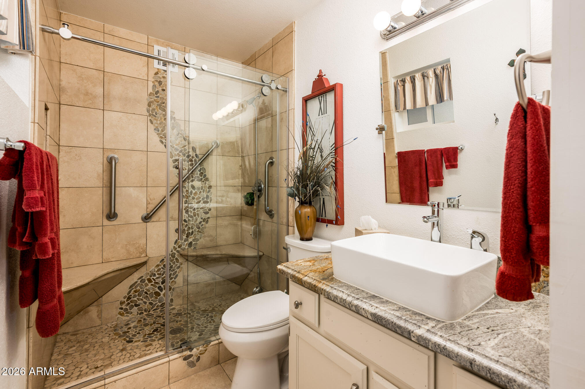 4730 West Piedmont Road Laveen, AZ 85339 - Photo 23 of 65 a bathroom with a granite countertop sink a toilet and shower