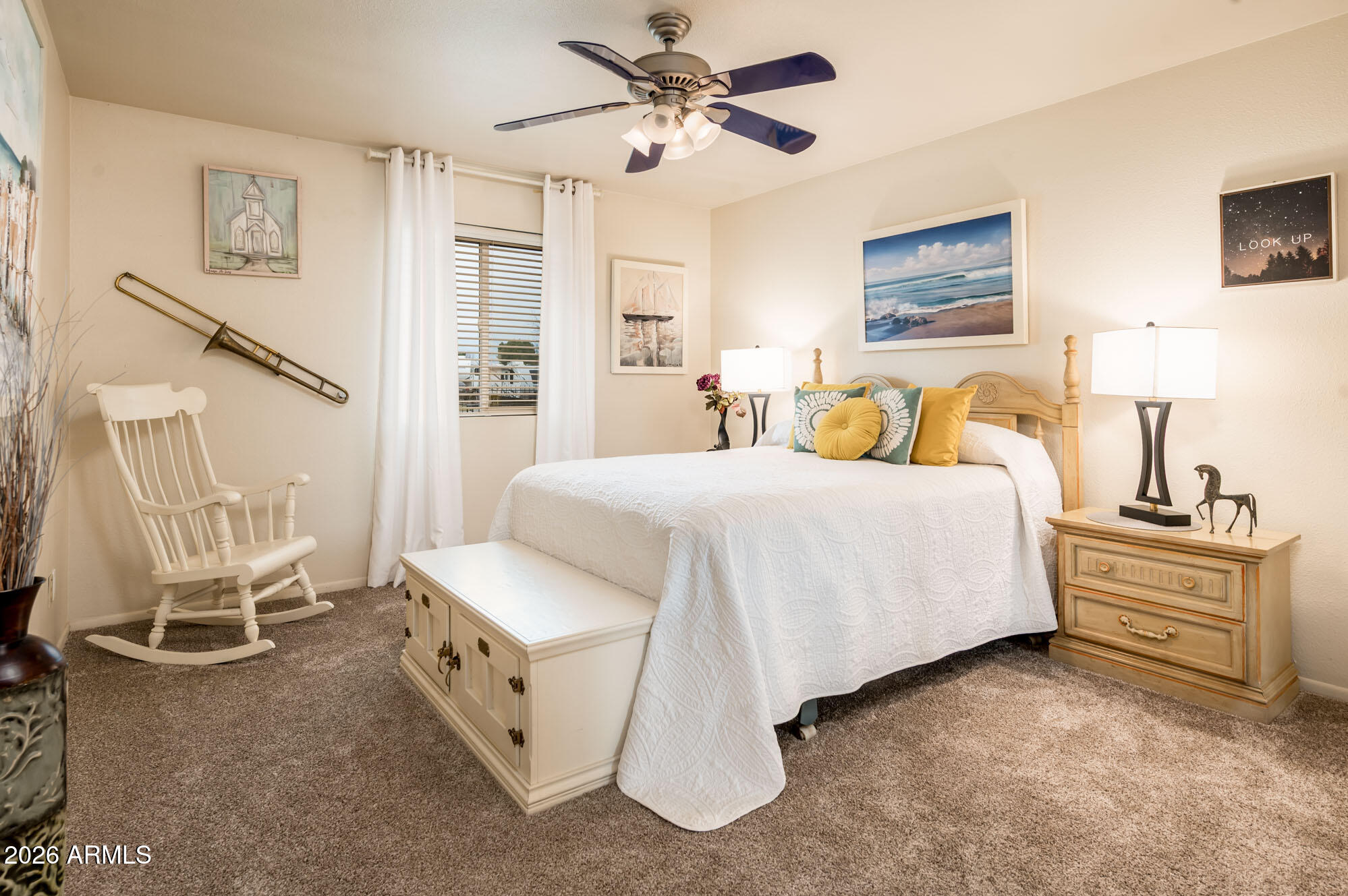 4730 West Piedmont Road Laveen, AZ 85339 - Photo 25 of 65 a spacious bedroom with a bed and a table