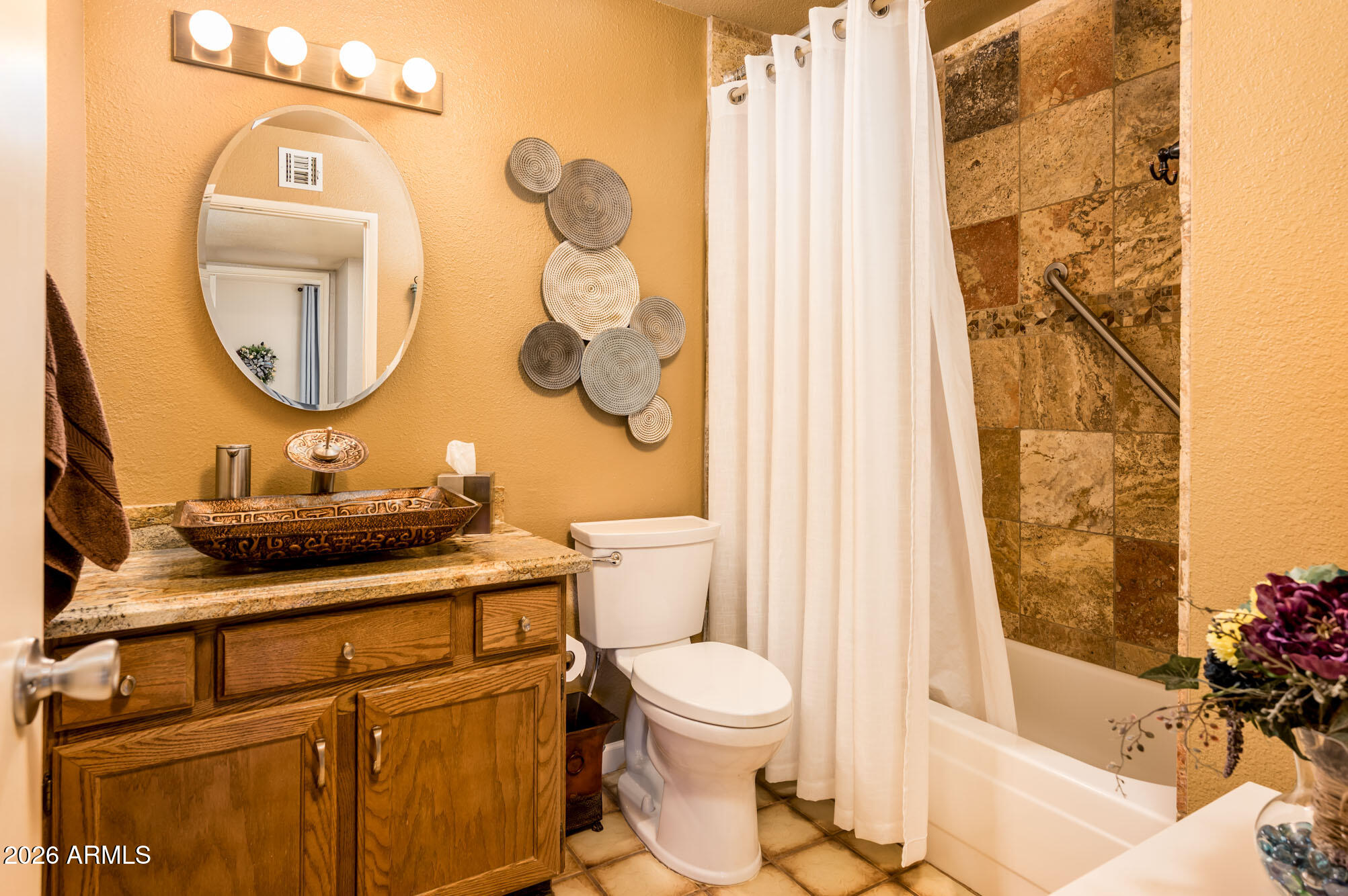 4730 West Piedmont Road Laveen, AZ 85339 - Photo 27 of 65 a bathroom with a sink a toilet and a mirror