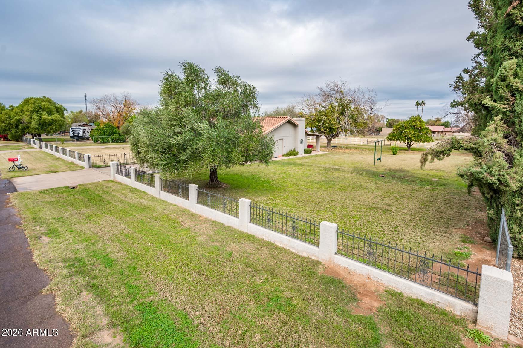 4730 West Piedmont Road Laveen, AZ 85339 - Photo 4 of 65 a view of a swimming pool with an outdoor space and seating area