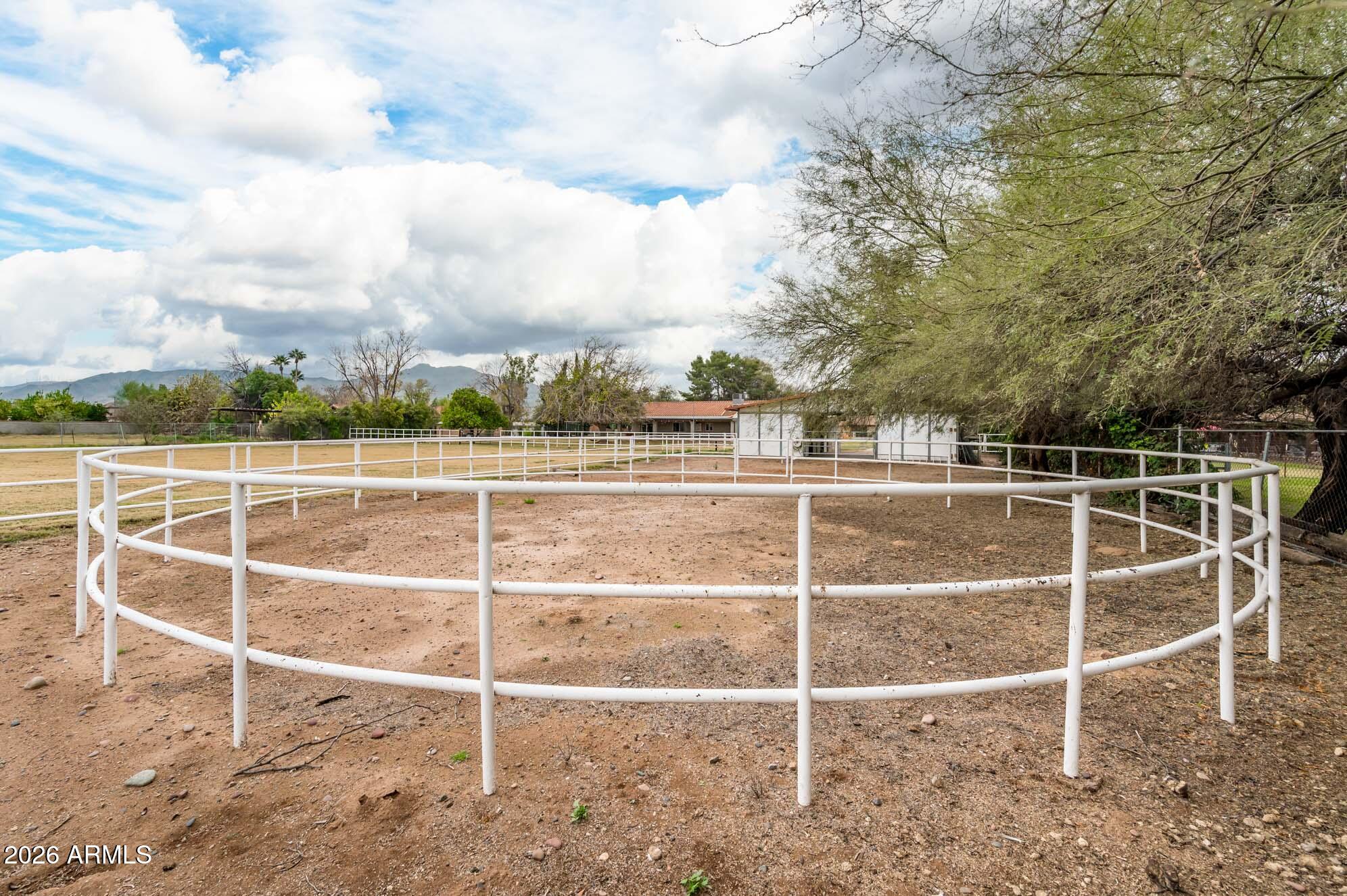 4730 West Piedmont Road Laveen, AZ 85339 - Photo 43 of 65 a view of an empty room with wooden floor and fence