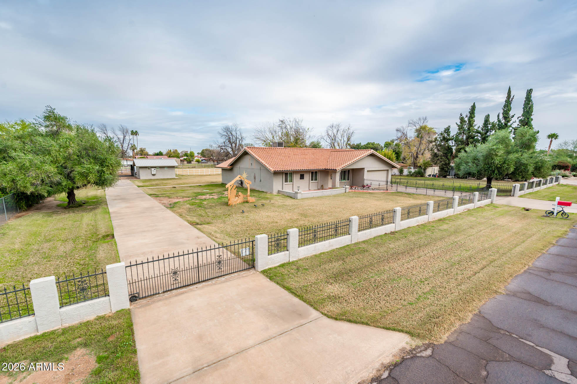 4730 West Piedmont Road Laveen, AZ 85339 - Photo 5 of 65 a view of a swimming pool with an outdoor seating and a garden